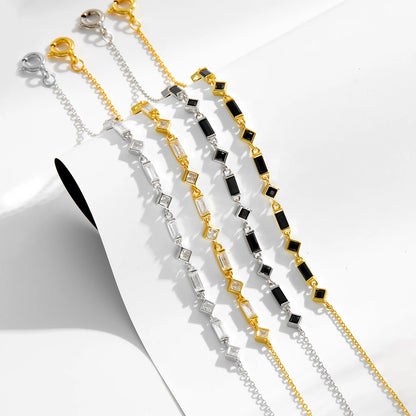 Silver bracelet with alternating square and rectangular black stones on a fine chain, from the Vindemia line.


