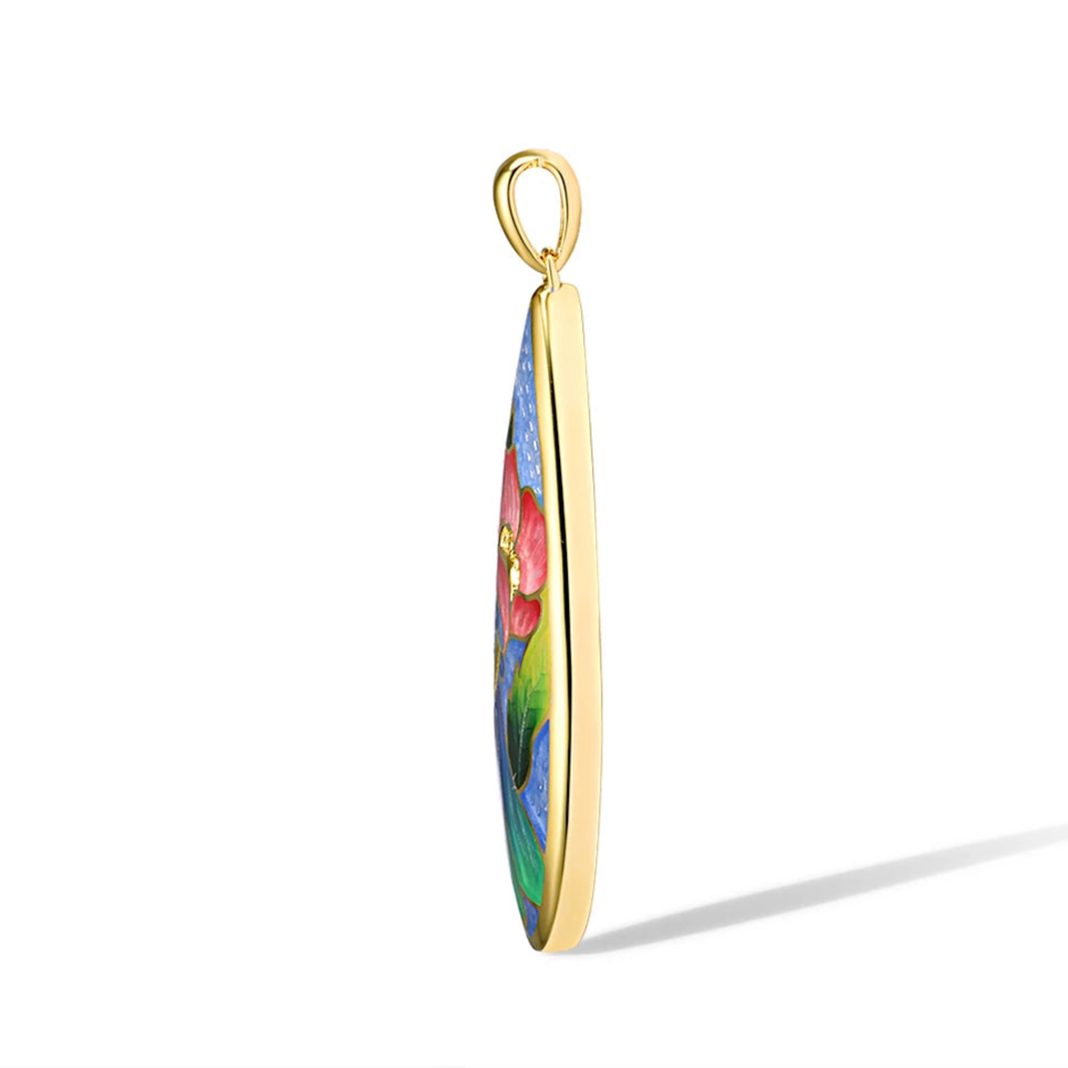 Teardrop-shaped gold pendant with a vivid enamel design featuring a red flower, blue butterfly, green leaves, and subtle gemstone accents
