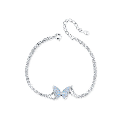 Delicate silver bracelet with a central opal butterfly charm and fine double chain


