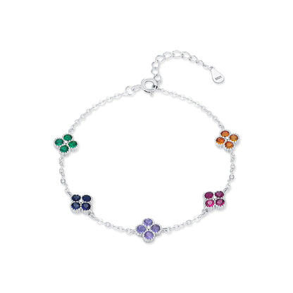 Silver bracelet with multicoloured gemstone clusters in floral shapes.

