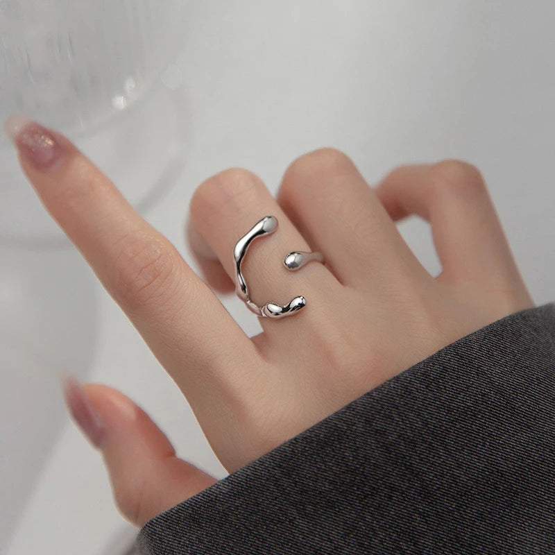 Sterling silver ring featuring a baroque freshwater pearl encased in an abstract organic claw setting

