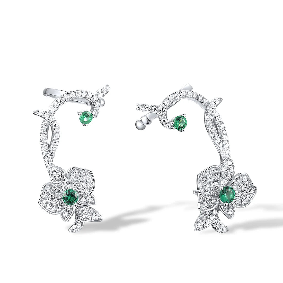 Floral vine-inspired earrings with sparkling white pavé and green gemstone accents

