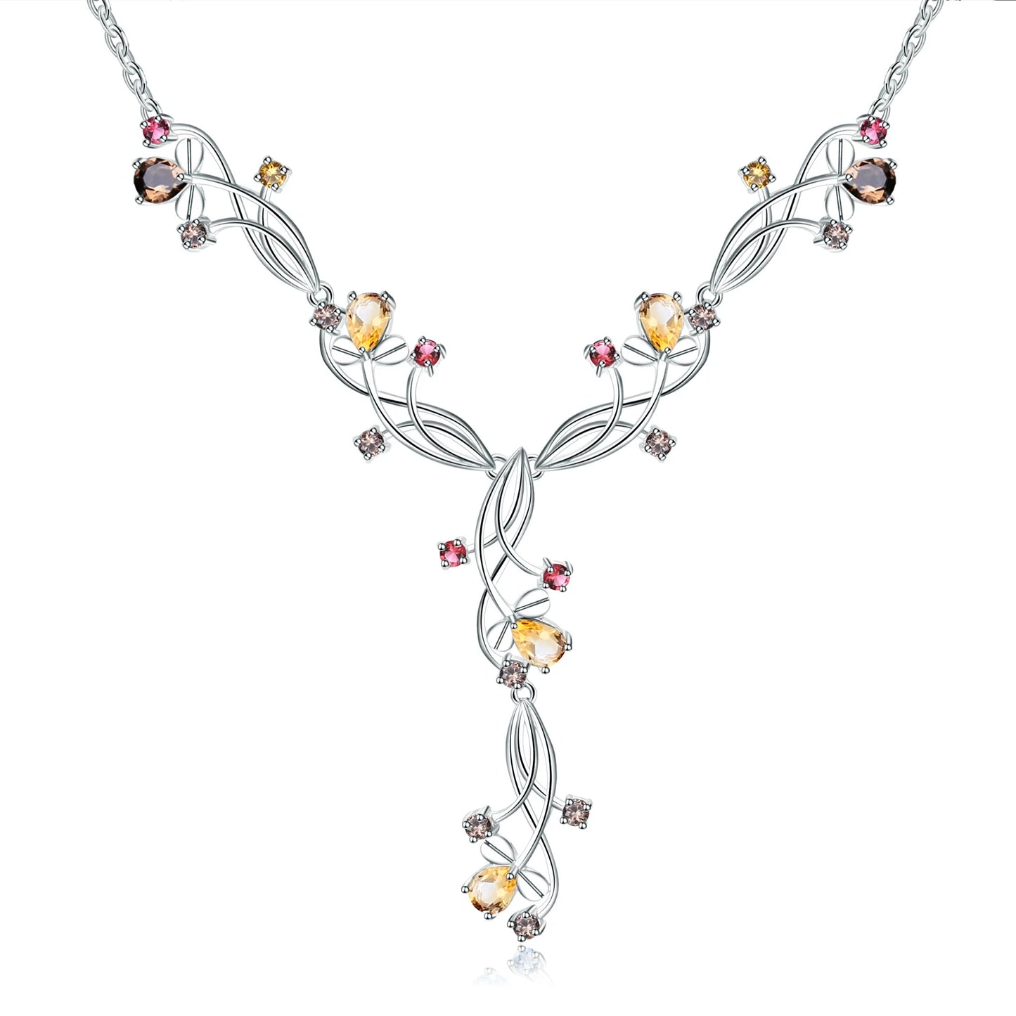 Silver necklace with an intricate swirling design, adorned with multicolored gemstones in pink, yellow, brown, and clear tones.

