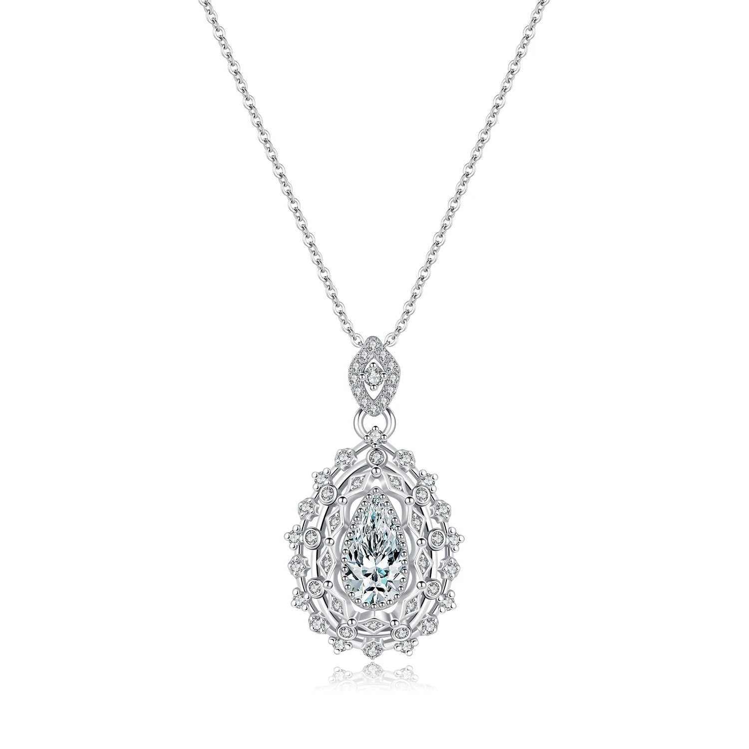 Ornate silver necklace with an intricate teardrop pendant, featuring a central pear-cut white gemstone, part of the Bianco Nero collection.

