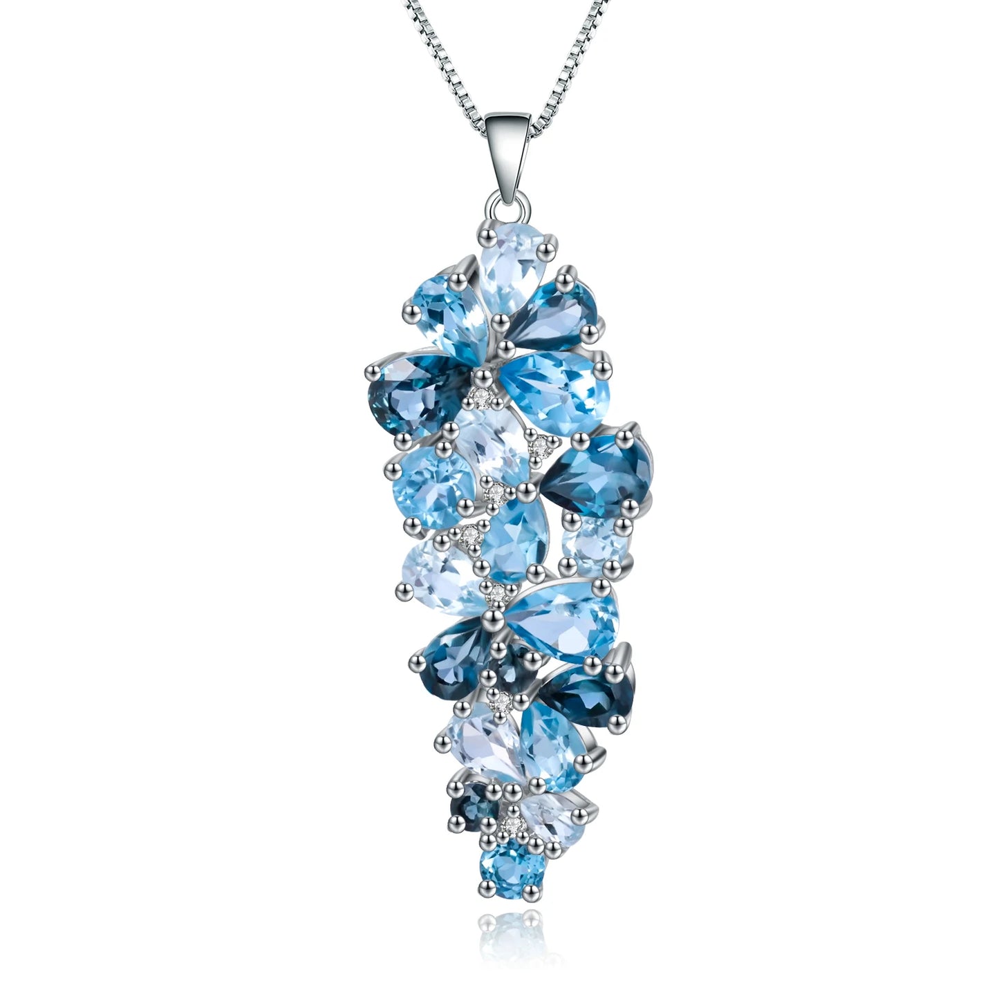 Silver pendant featuring a cascading cluster of mixed-cut blue gemstones in varying tones


