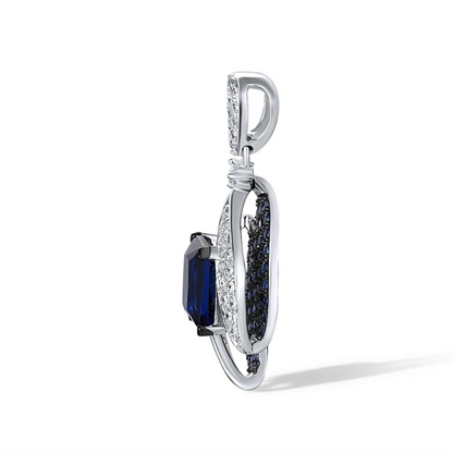 Sterling silver pendant with a rectangular dark blue gemstone surrounded by curving pavé-set bands and clustered blue stones