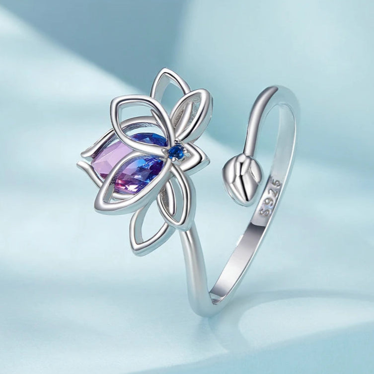 Sterling silver lotus flower ring with pink and blue gradient gemstone and small blue accent stone

