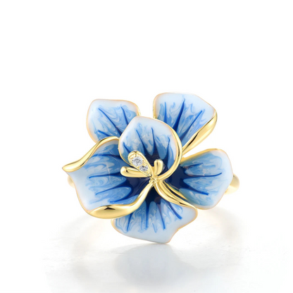 Gold-plated ring with hand-painted blue and white enamel flower and crystal accents

