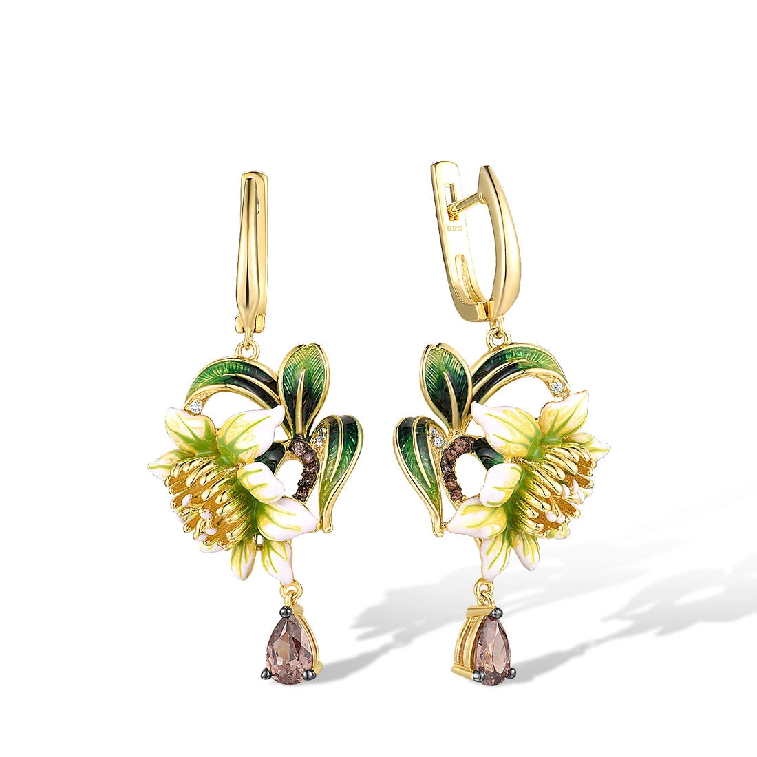 Gold drop earrings featuring white enamel flowers, green leaf detailing, and teardrop gemstones

