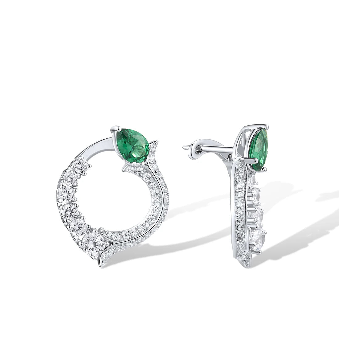 Silver earrings with circular diamond pave design and pear-shaped green jade stones at the top

