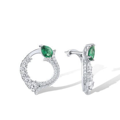 Silver earrings with circular diamond pave design and pear-shaped green jade stones at the top

