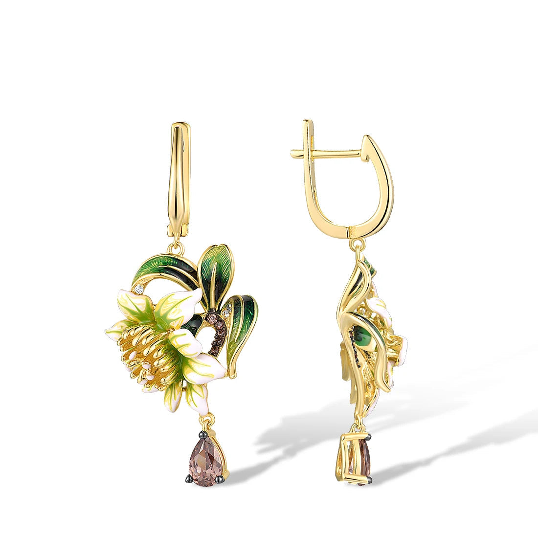 Gold drop earrings featuring white enamel flowers, green leaf detailing, and teardrop gemstones

