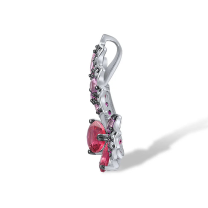 Butterfly ring with sculpted wings in pink and fuchsia gemstones and teardrop-shaped stones forming the body.

