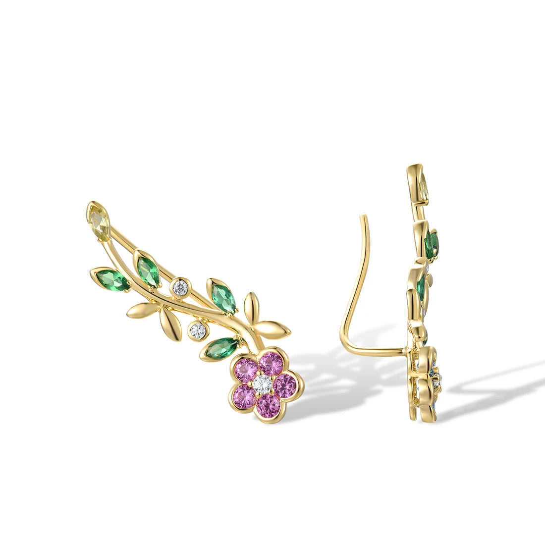 Asymmetrical gold earrings with colorful crystal flowers and green gemstone vines

