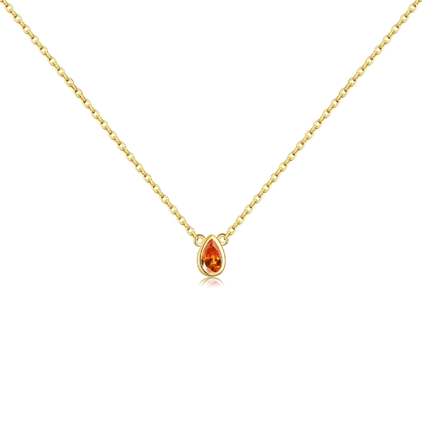 Gold necklace with a pear-shaped pink gemstone pendant at the center.

