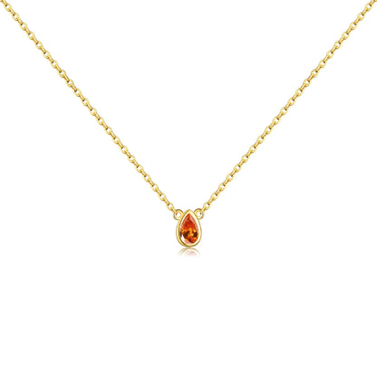 Gold necklace with a pear-shaped pink gemstone pendant at the center.

