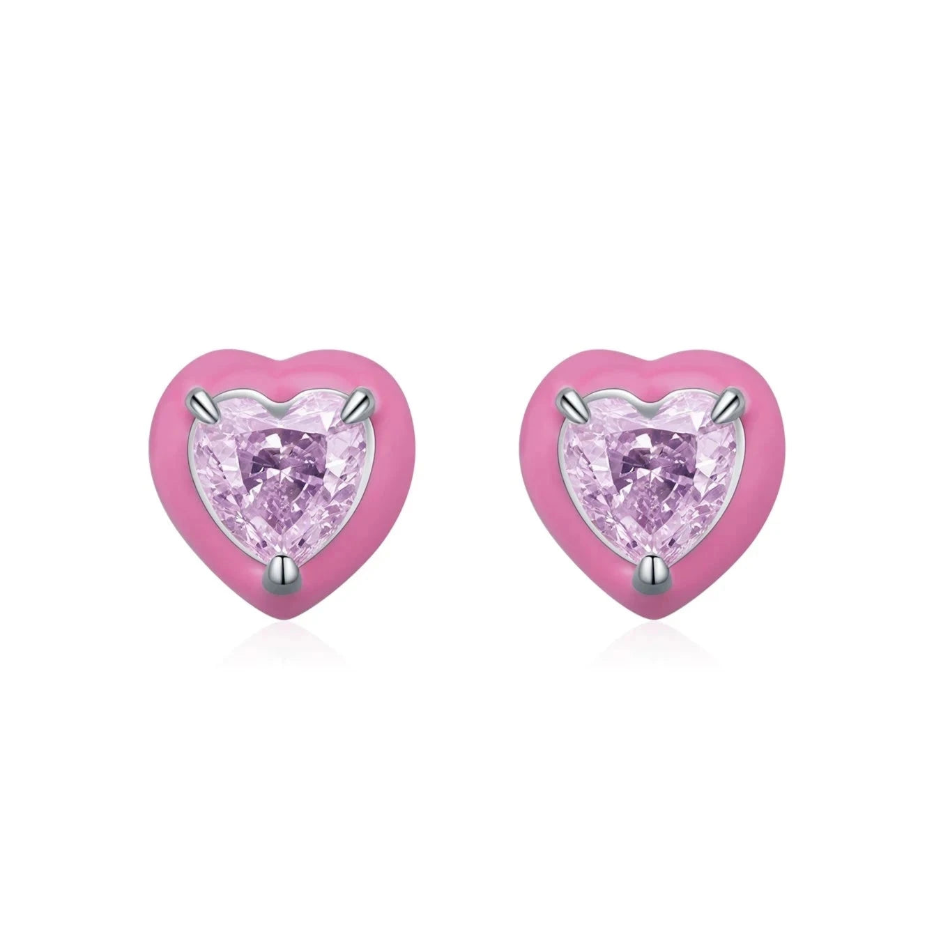 Stud earrings shaped like soft pink hearts, each set with a sparkling light pink heart-cut gemstone.

