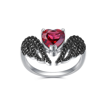 Sterling silver ring with a heart-shaped black gemstone flanked by pavé-set wing-like details, from the Ali Nere design.

