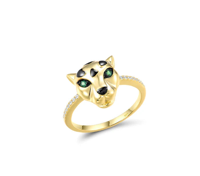 Gold jewelry set featuring panther heads with black spots and green eyes, including earrings, pendant, and ring

