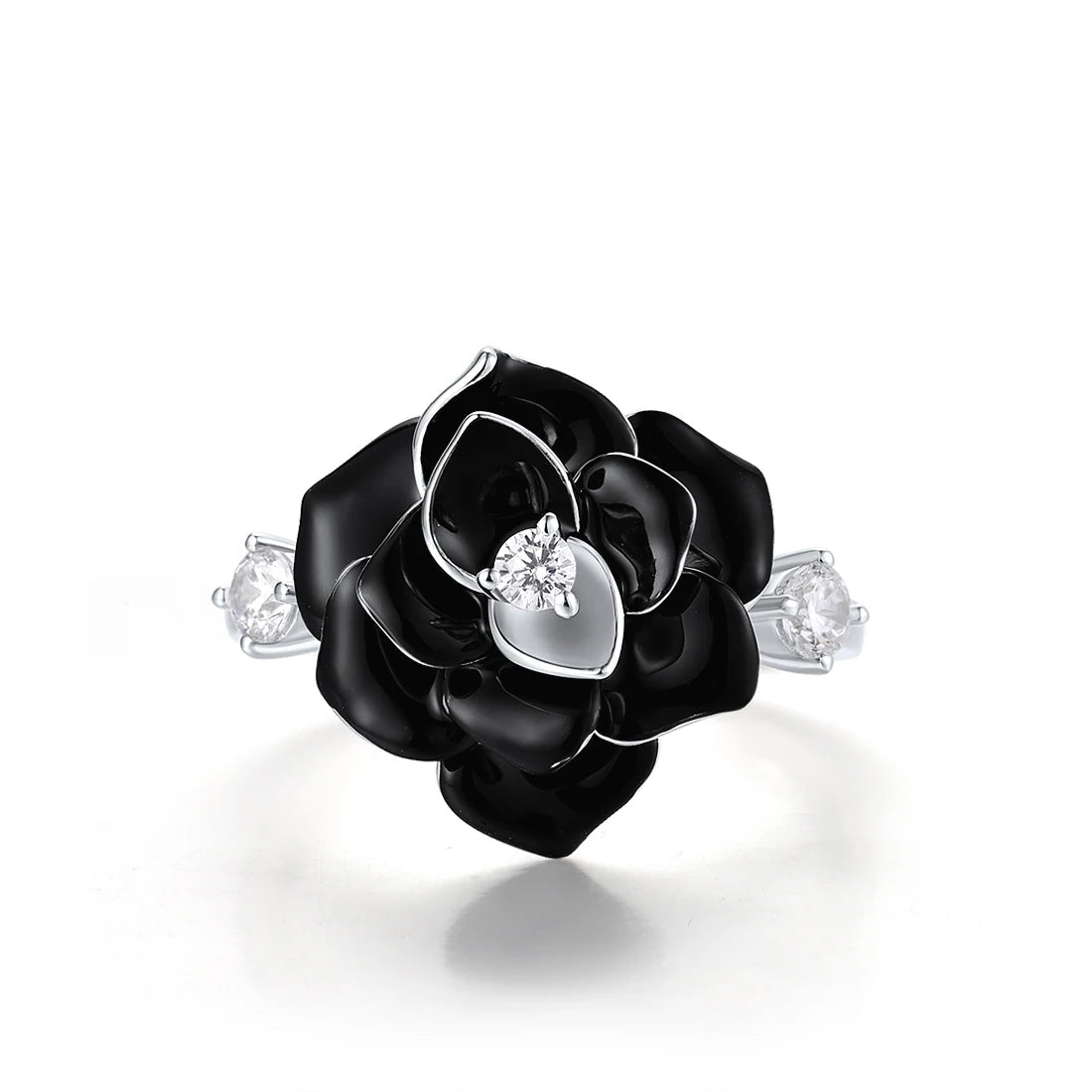 Silver ring with a black enamel rose centerpiece and two clear gemstones on the band.

