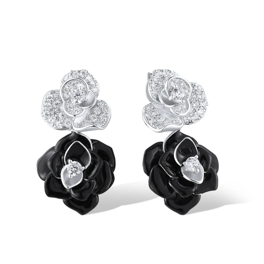 Silver and black enamel earrings shaped like layered roses with pavé accents

