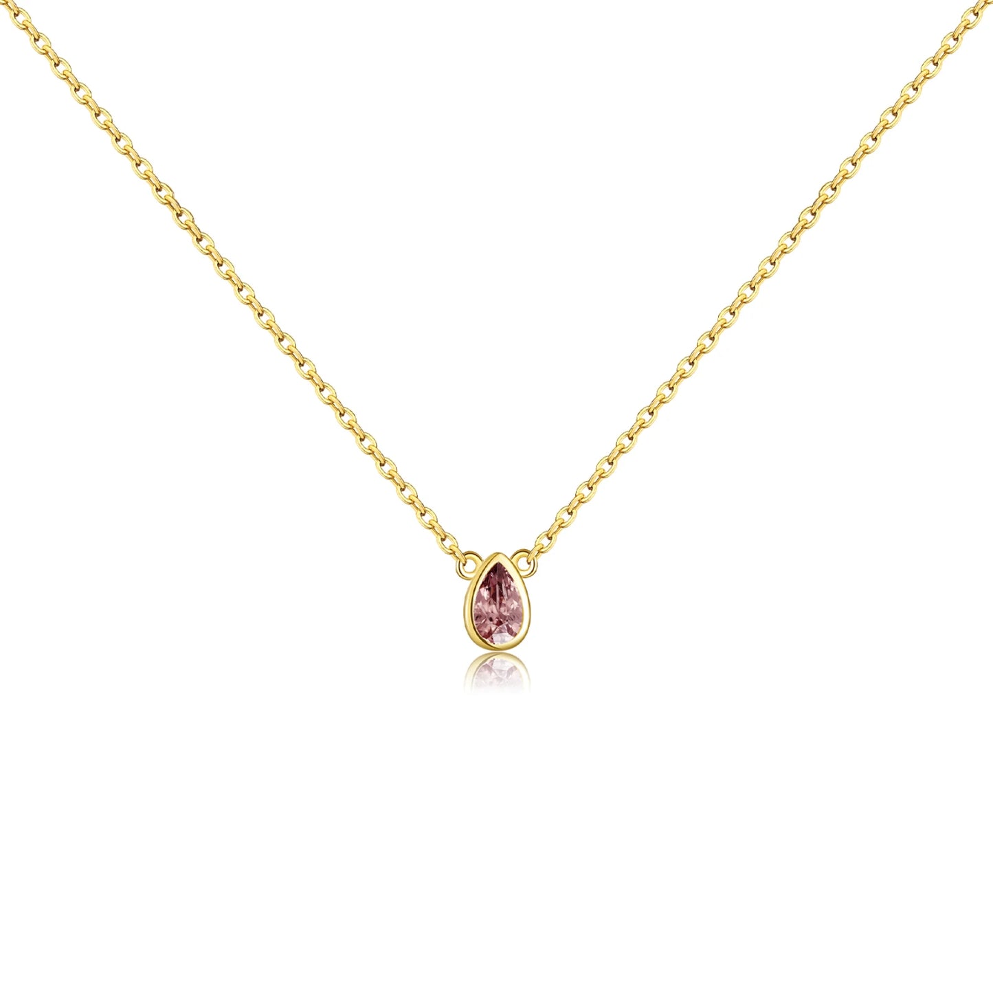 Gold necklace with a pear-shaped pink gemstone pendant at the center.

