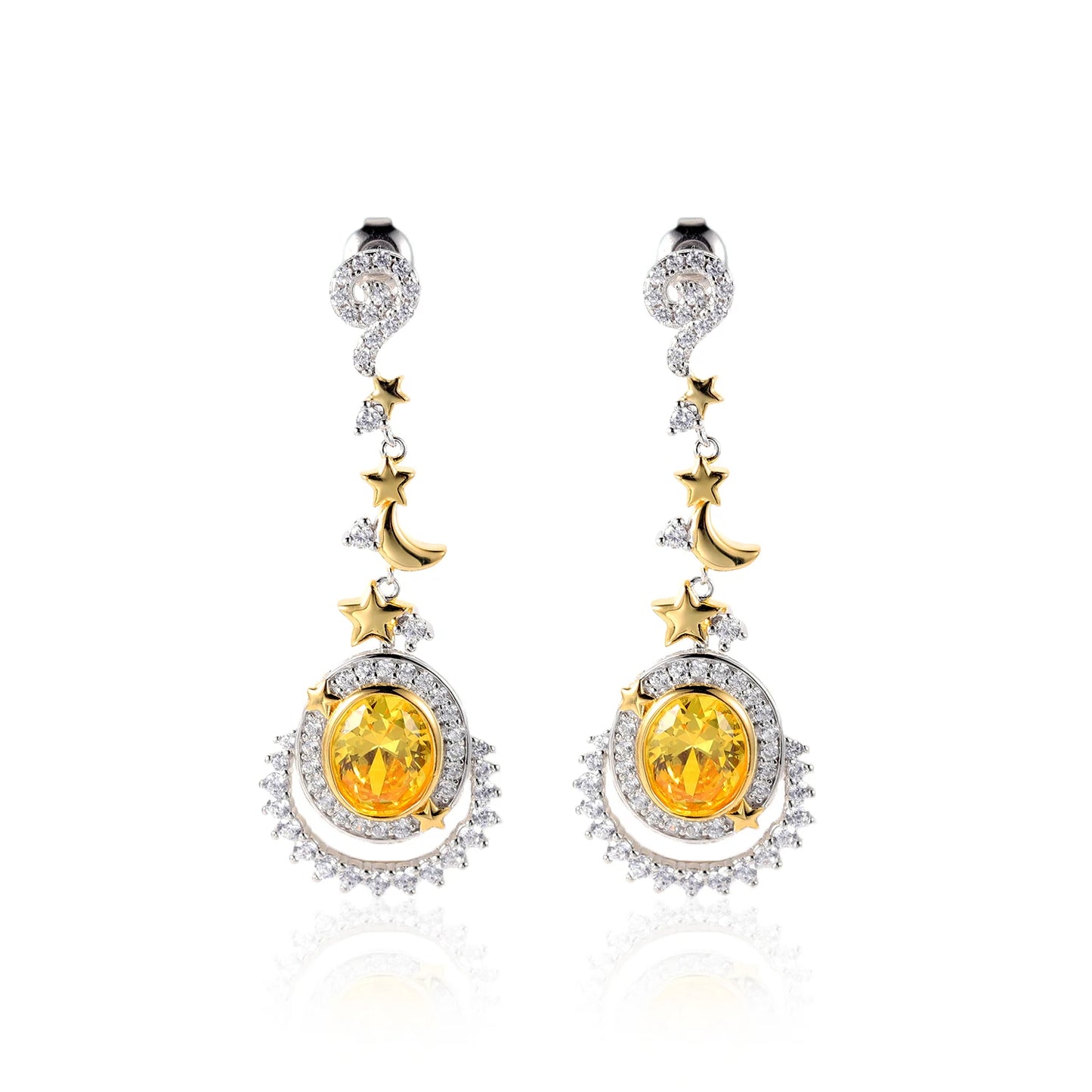 Dangling earrings with yellow gemstones, crescent moons, and star accents in gold and silver

