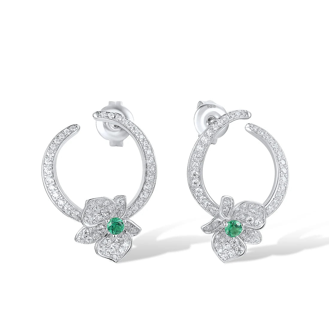 Silver stud earrings with open circle design, pavé stones, and green gemstone floral accents

