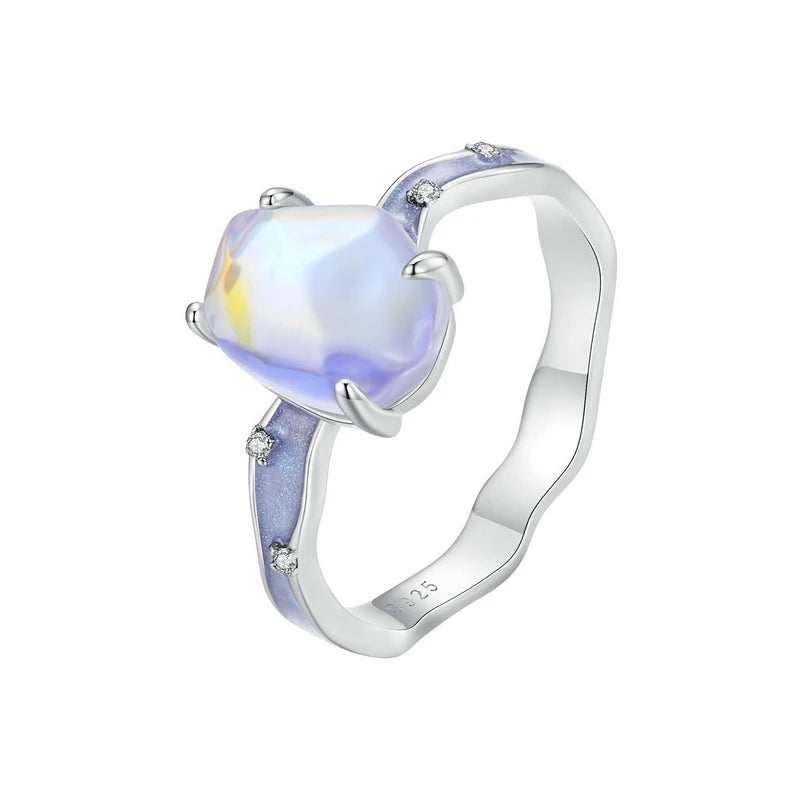 Silver ring with a heart-shaped gemstone on a white background