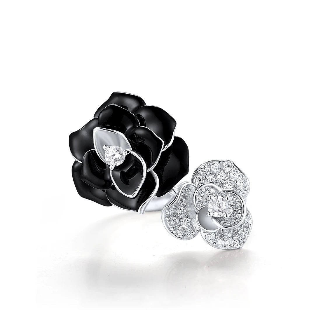 Black and white enamel floral ring with central clear stones in open bypass style

