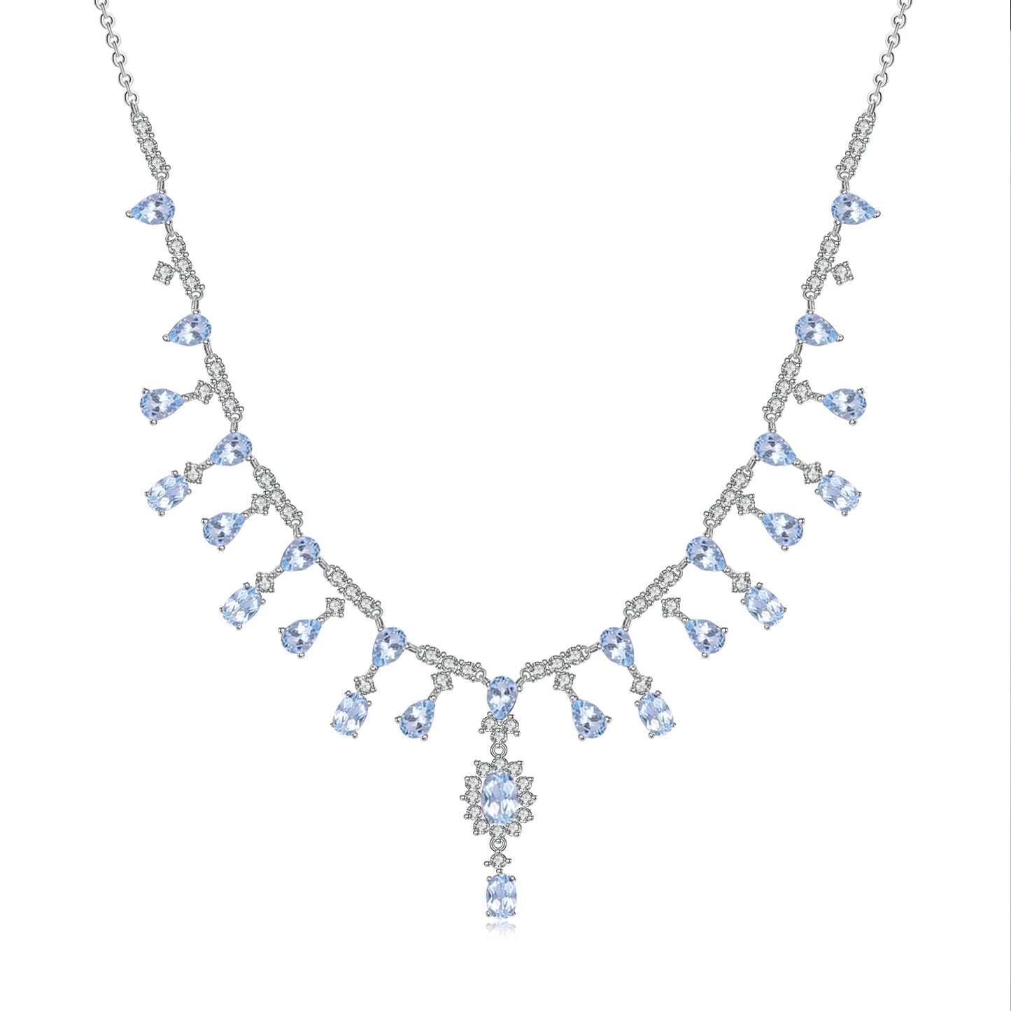 A silver necklace featuring green garnet stones set in an oval pattern with additional small white stones on a link chain.
