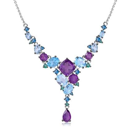 Necklace with gradient blue and green gemstones arranged in an organic cascading pattern

