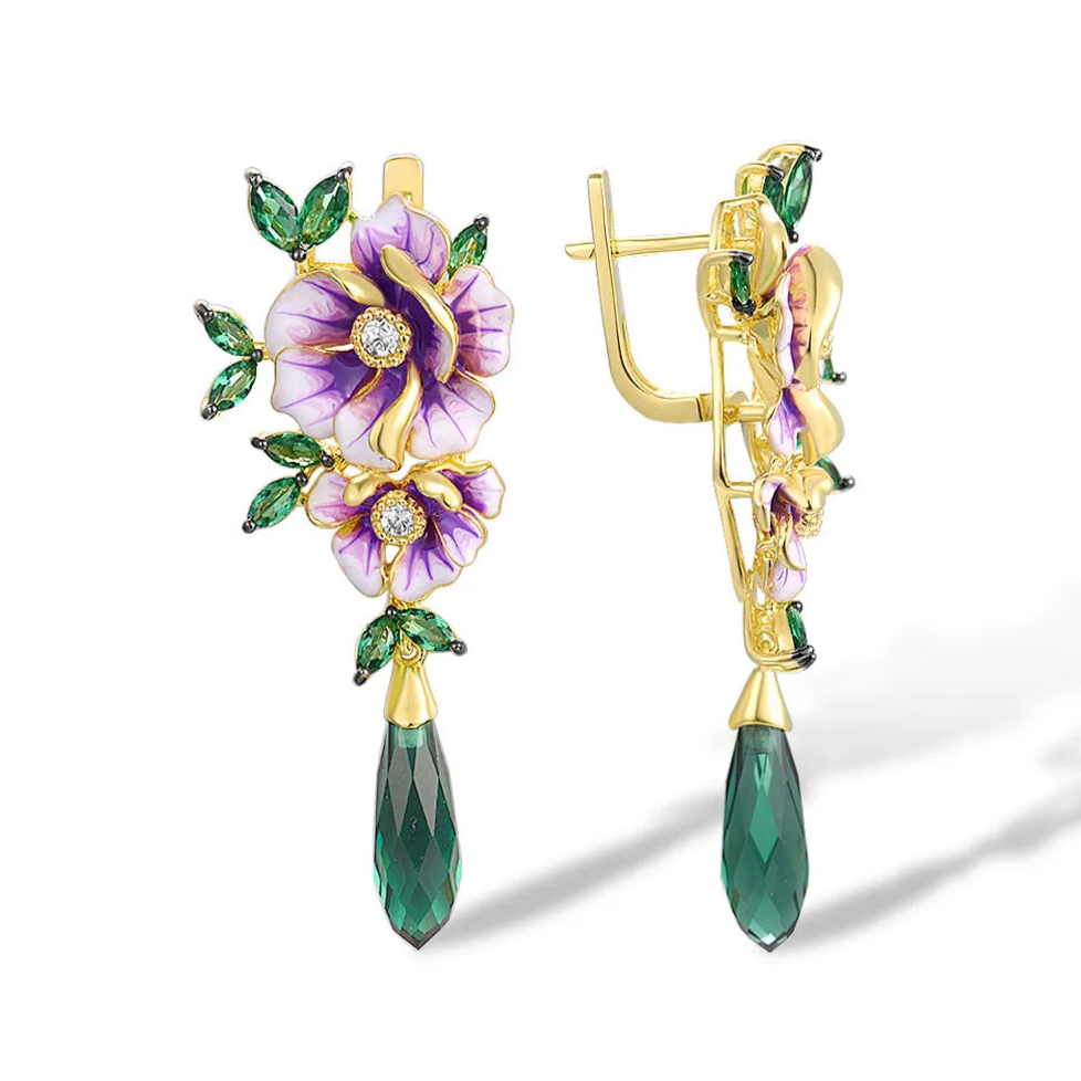 Gold earrings with purple enamel flowers, green marquise leaves, and elongated dark green crystal drops

