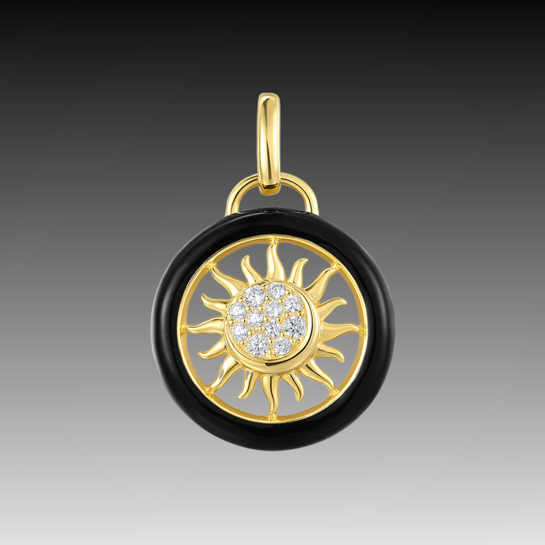 Gold and black circular sun pendant with clear stones at the center, titled Solis Oro.

