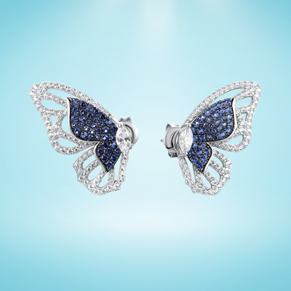 Sterling silver butterfly stud earrings with blue and white gemstones

