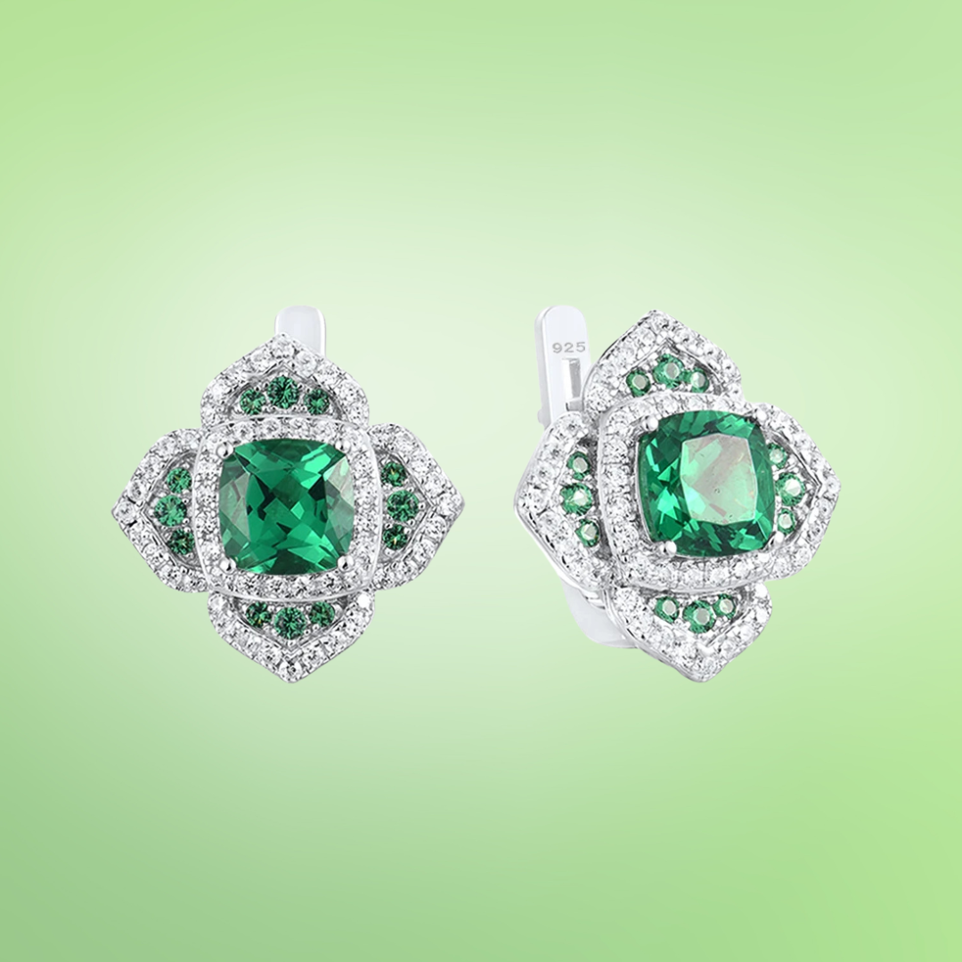 Cushion-cut green gemstone earrings with layered silver and green pavé accents

