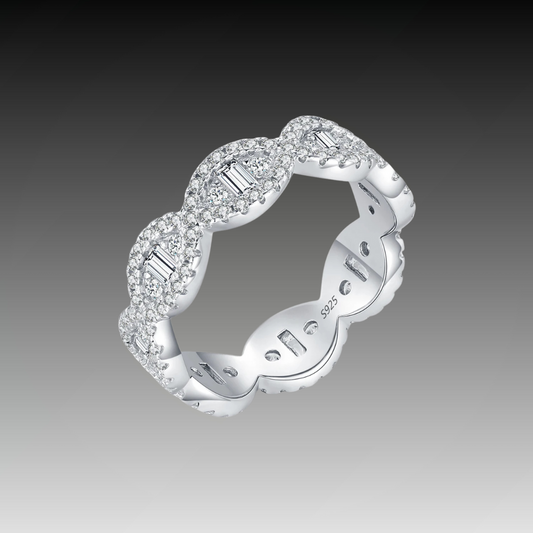 Silver eternity band with scalloped edges and baguette-cut cubic zirconia accents


