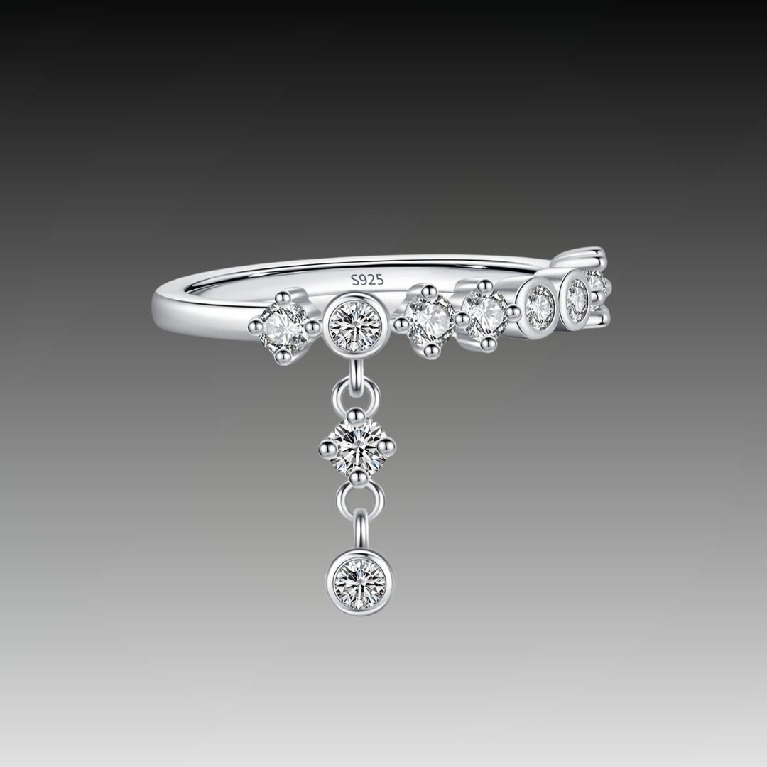 Silver ring with a line of round-cut stones and three delicate cubic zirconia drops
