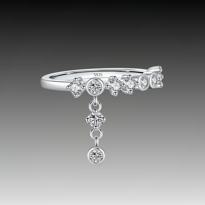 Silver ring with a line of round-cut stones and three delicate cubic zirconia drops