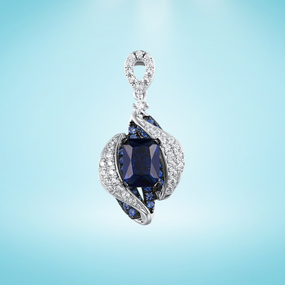 Sterling silver pendant with a rectangular dark blue gemstone surrounded by curving pavé-set bands and clustered blue stones