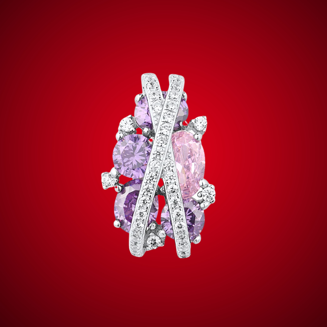 Ring featuring overlapping pavé crystal bands over clustered purple and pink gemstones in various cuts.

