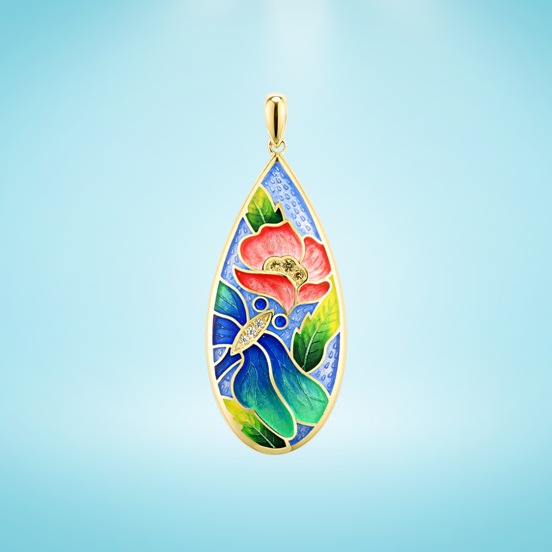 Teardrop-shaped gold pendant with a vivid enamel design featuring a red flower, blue butterfly, green leaves, and subtle gemstone accents