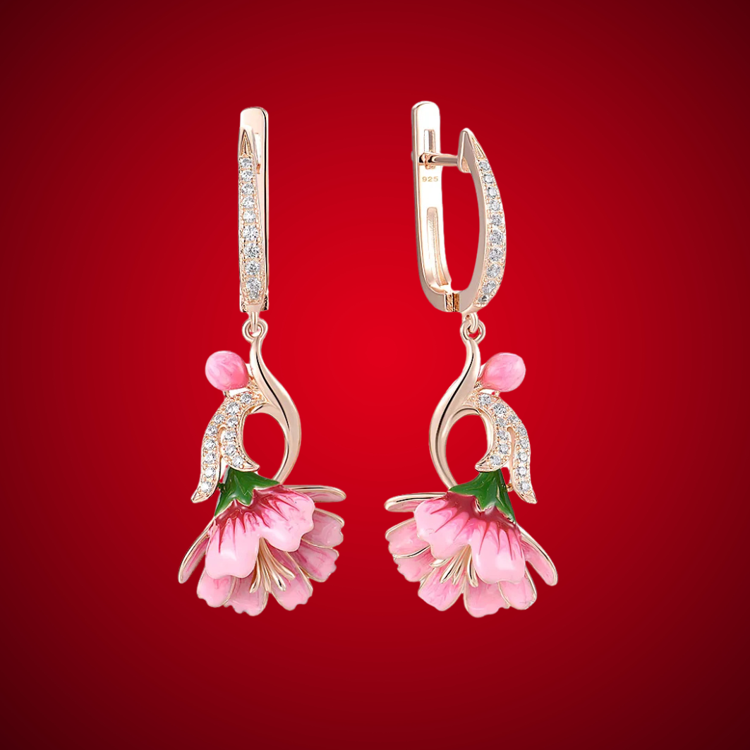 Fiore Pressato earrings shaped like delicate pink bell flowers, accented with green and gold enamel and sparkling stones.

