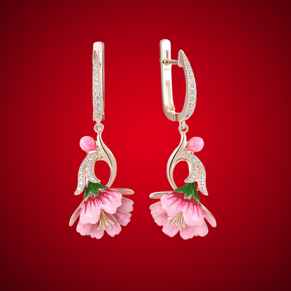 Fiore Pressato earrings shaped like delicate pink bell flowers, accented with green and gold enamel and sparkling stones.

