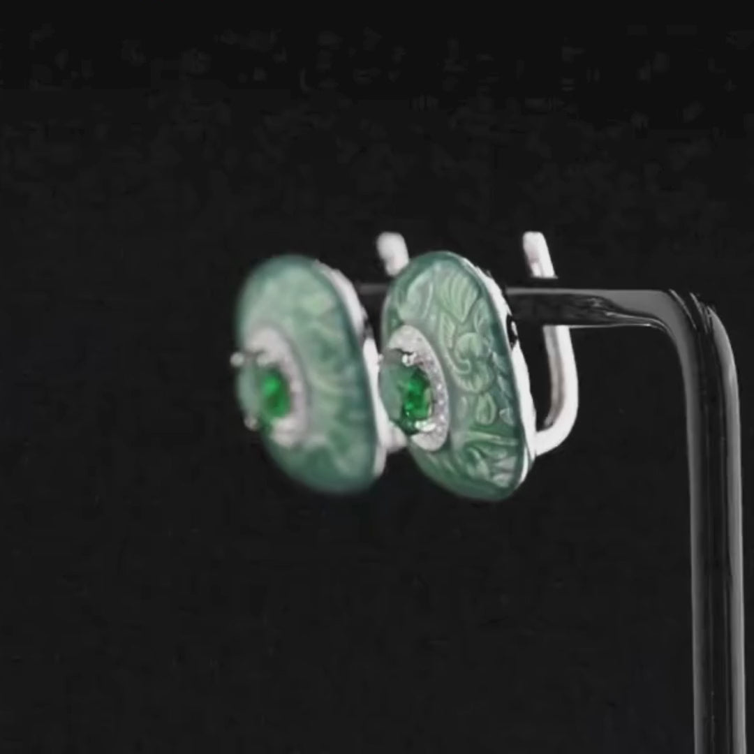 Square green enamel earrings with filigree floral pattern and central green round stones

