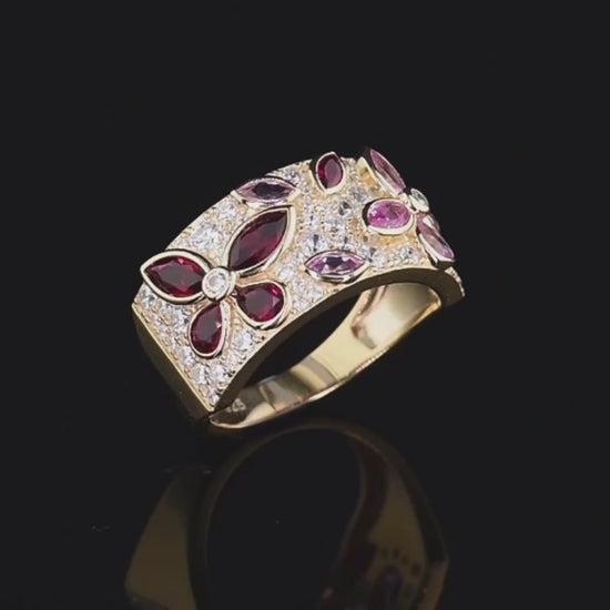 Gold ring set with marquise-cut pink and red stones forming floral patterns, Rosea from the Rossa Collection.

