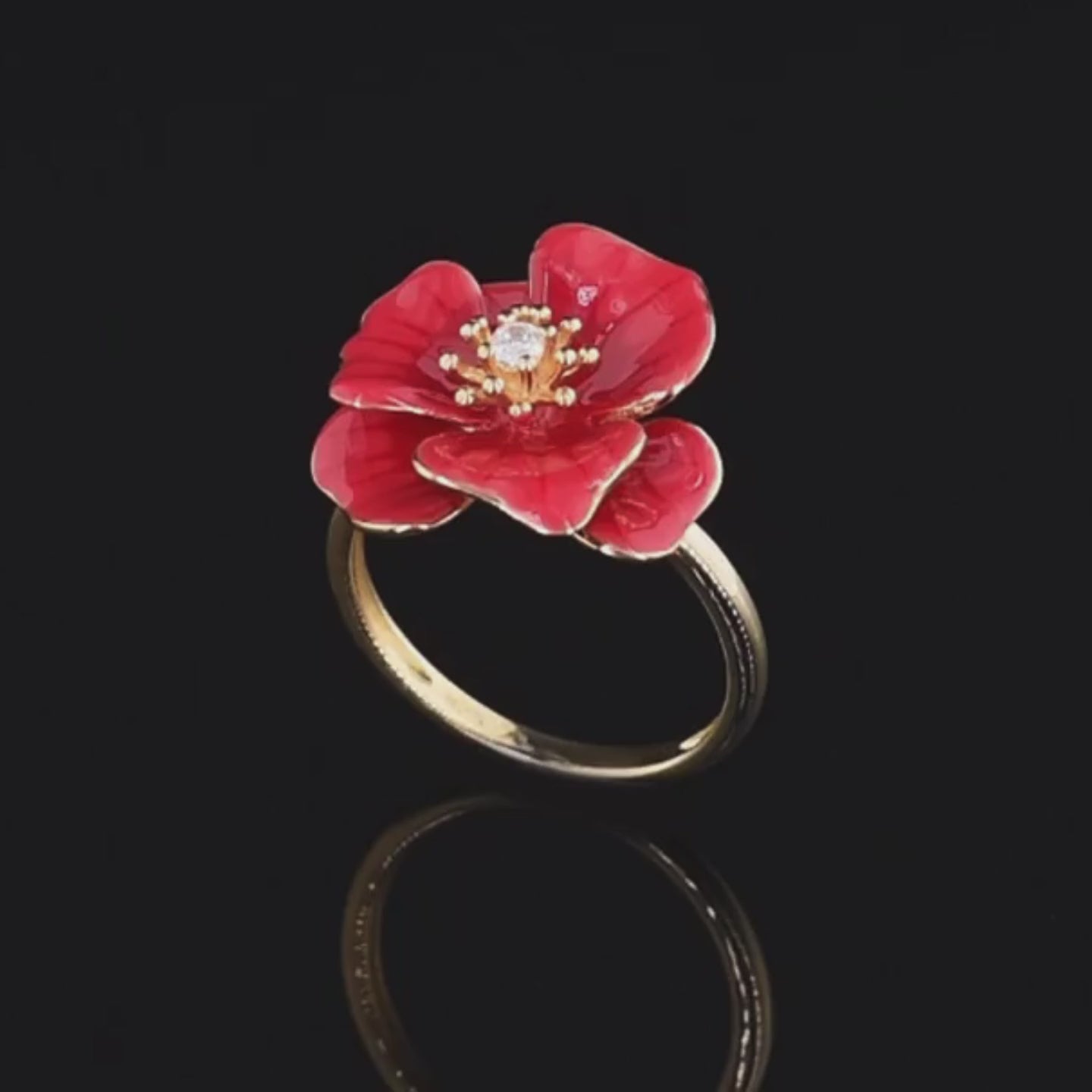 Gold ring featuring a red enamel rose with a white central stone, Rosa Rossa from the Rossa Collection.

