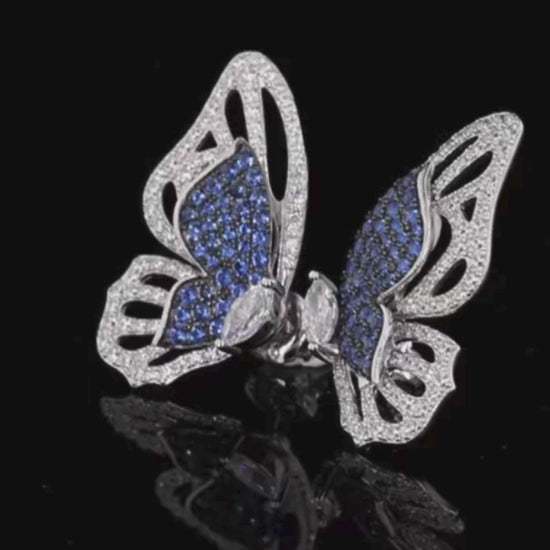Sterling silver butterfly stud earrings with blue and white gemstones

