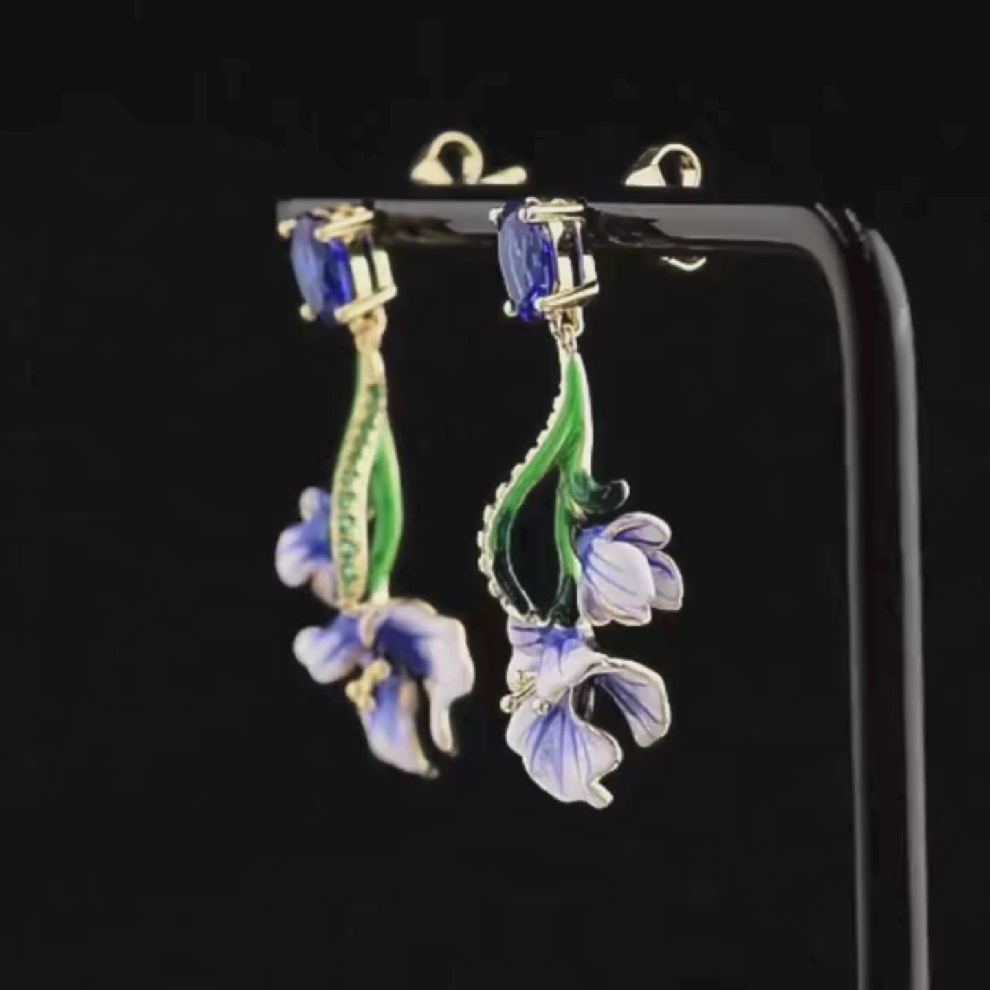 Gold-plated silver drop earrings with blue enamel Scilla flowers and oval sapphire-colored stones

