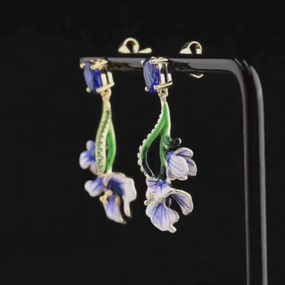 Gold-plated silver drop earrings with blue enamel Scilla flowers and oval sapphire-colored stones

